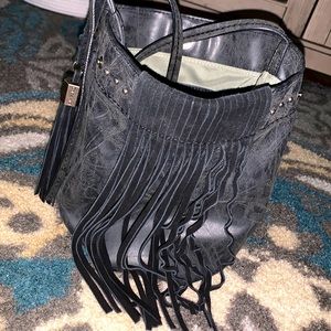 Fairly new crossbody bucket purse w/tassels